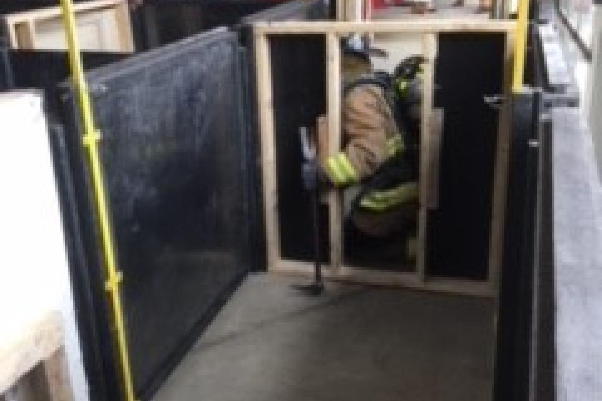 1st Firefighter team breaching and passing through a wall during search