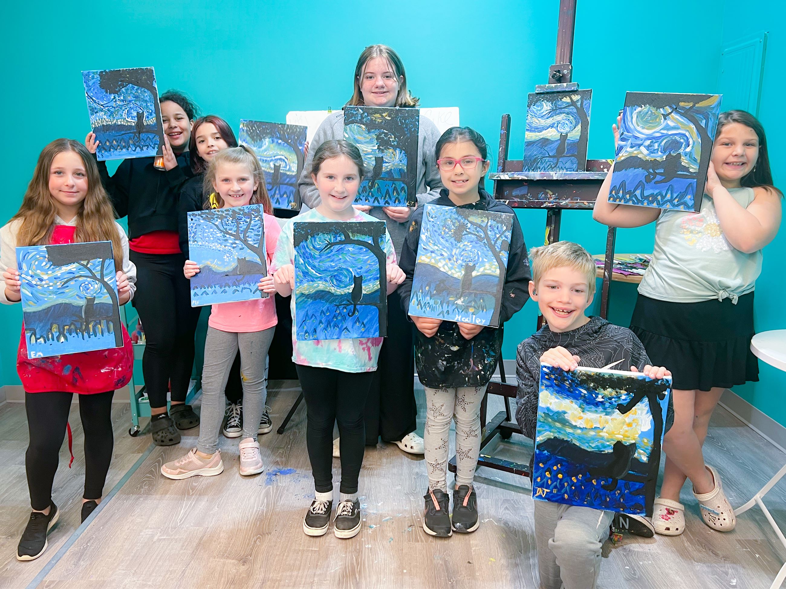 Kids show off their artwork at Hammar’s Studio. (COURTESY HAMMAR’S STUDIO)