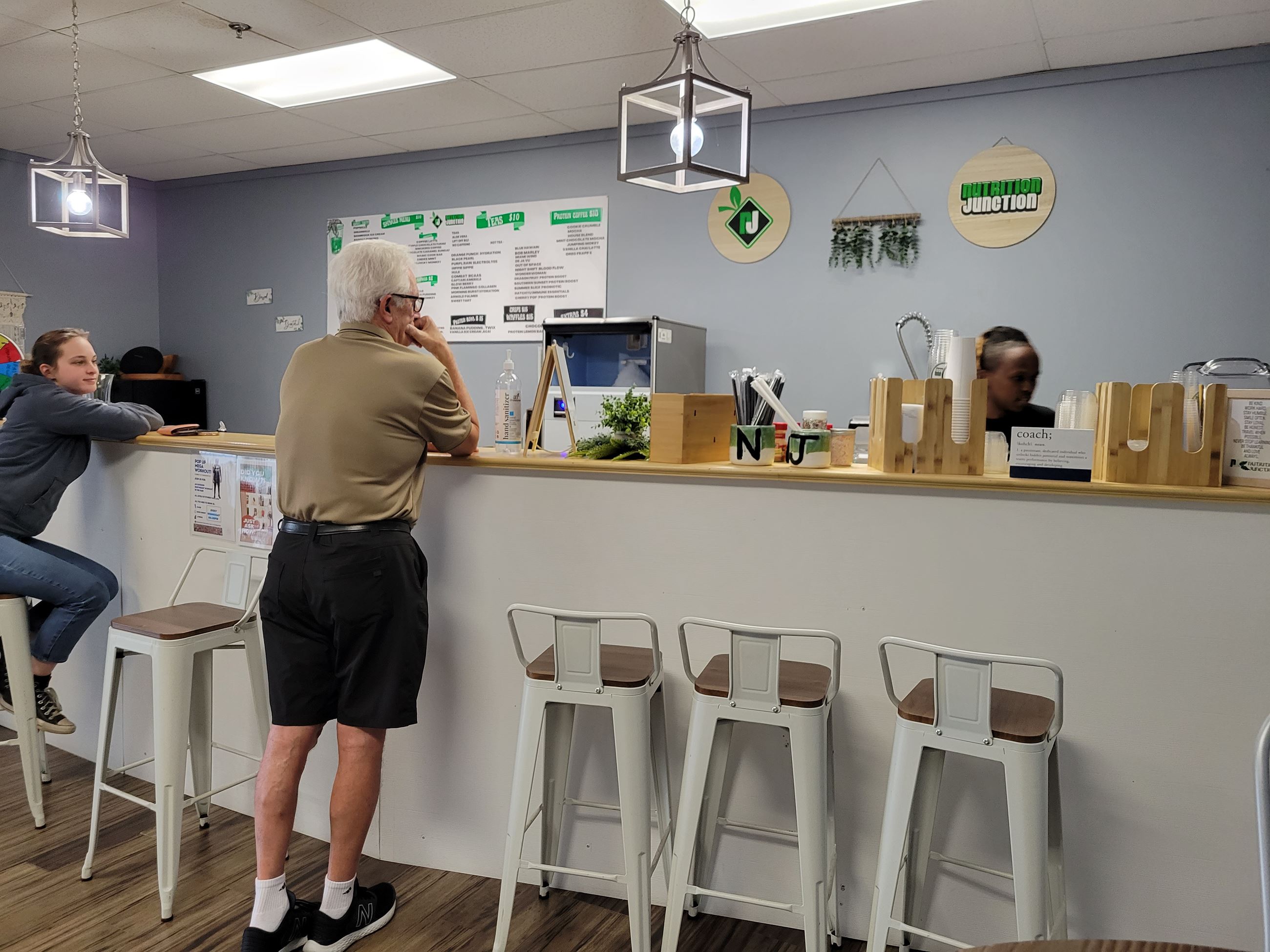 Arnold whips up shakes for Emily Paquette and Frank Provencher. (DRACUT ECONOMIC DEVELOPMENT)