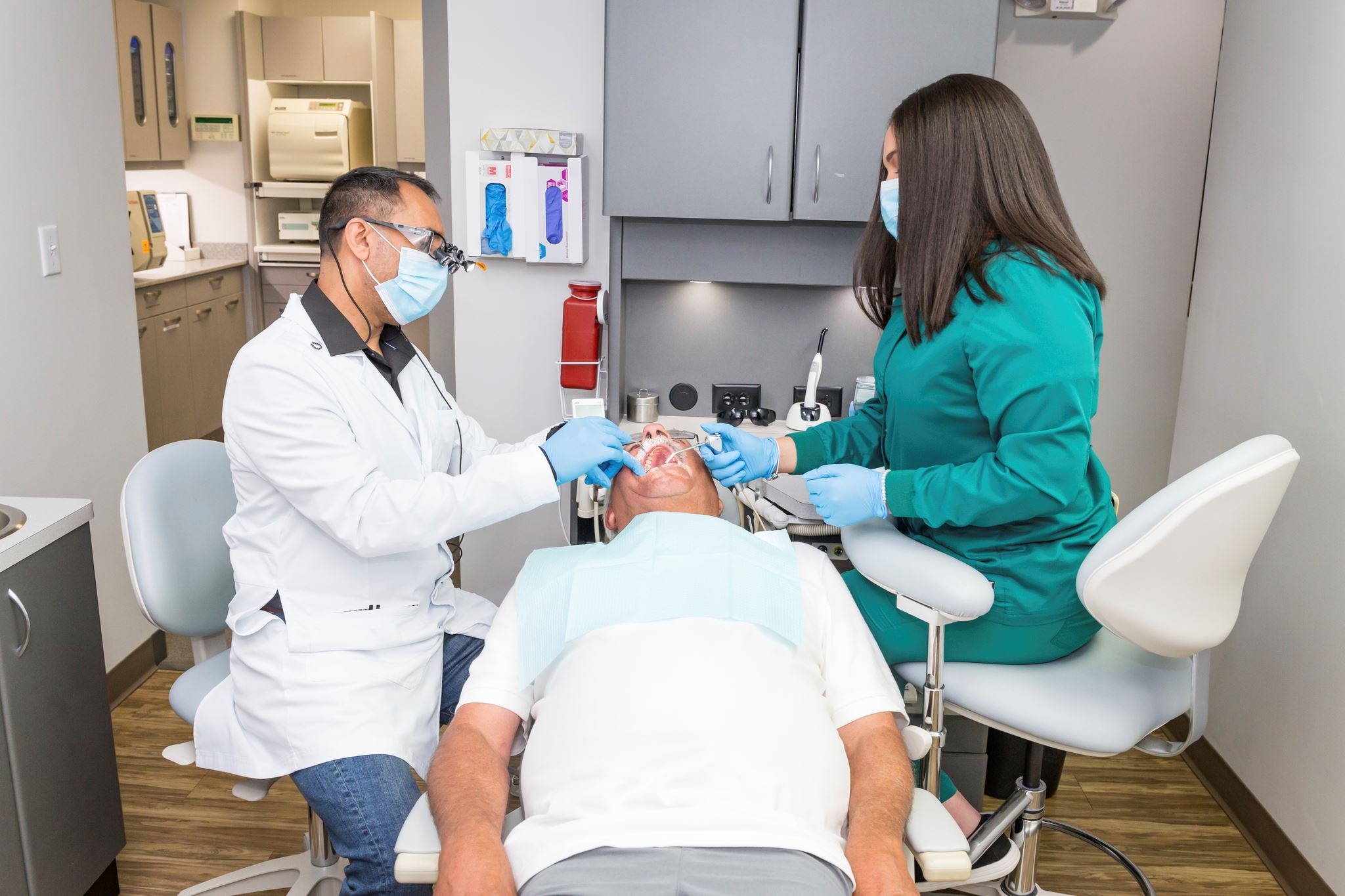 Say ahhhh: Dr. Dadiala and assistant Karla Vialet at work. (COURTESY DADIALA FAMILY DENTISTRY)