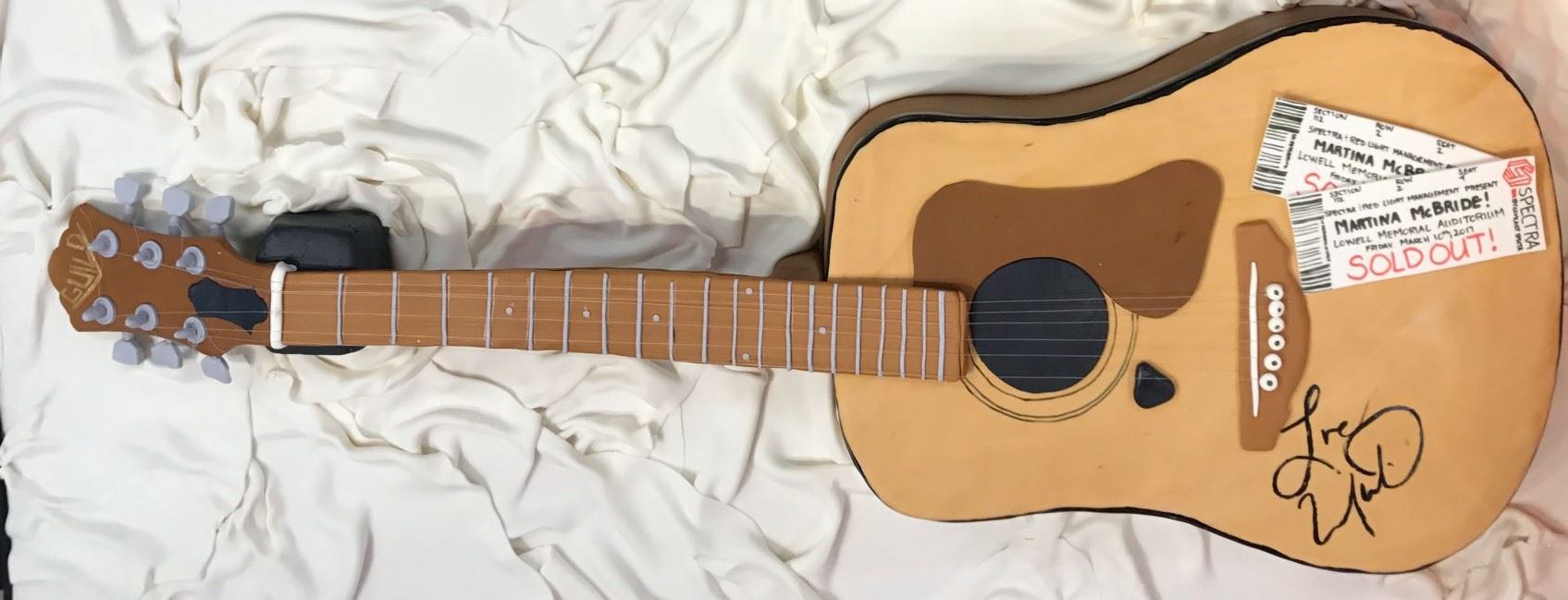 A cake in the shape of a guitar created for country singer Martina McBride